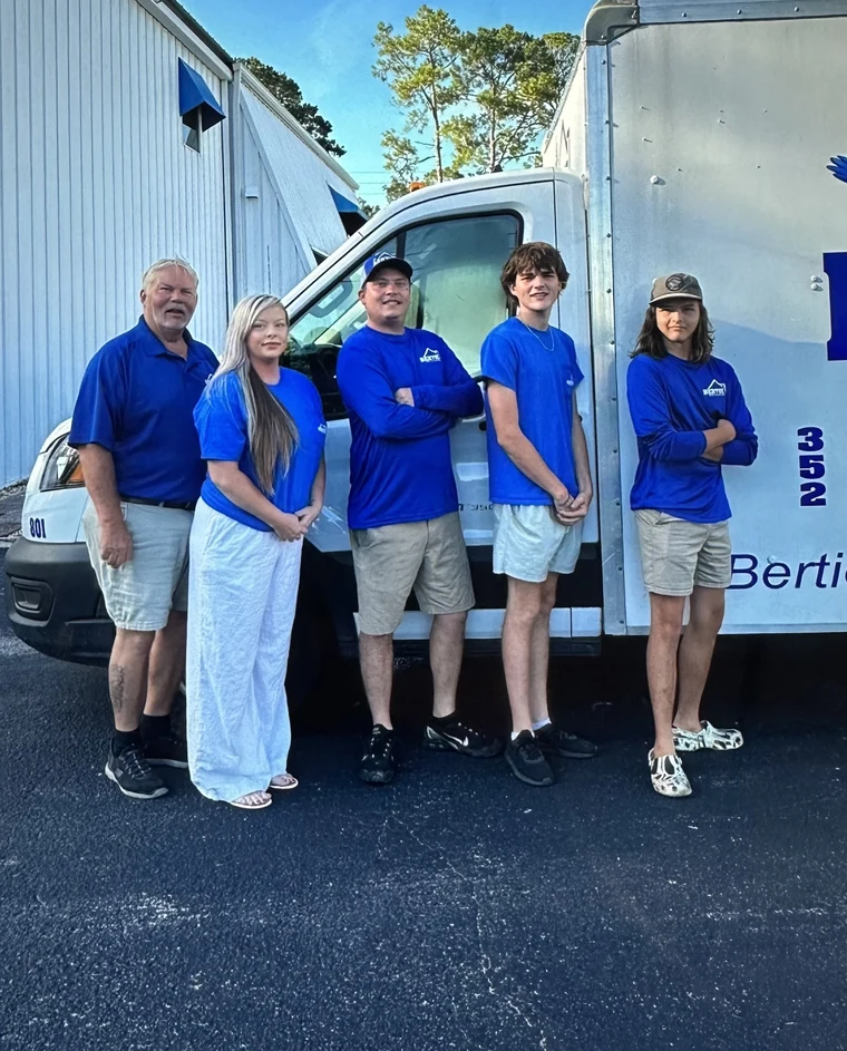 The Bertie family team standing in front of the Bertie Heating & Air building in Gainesville